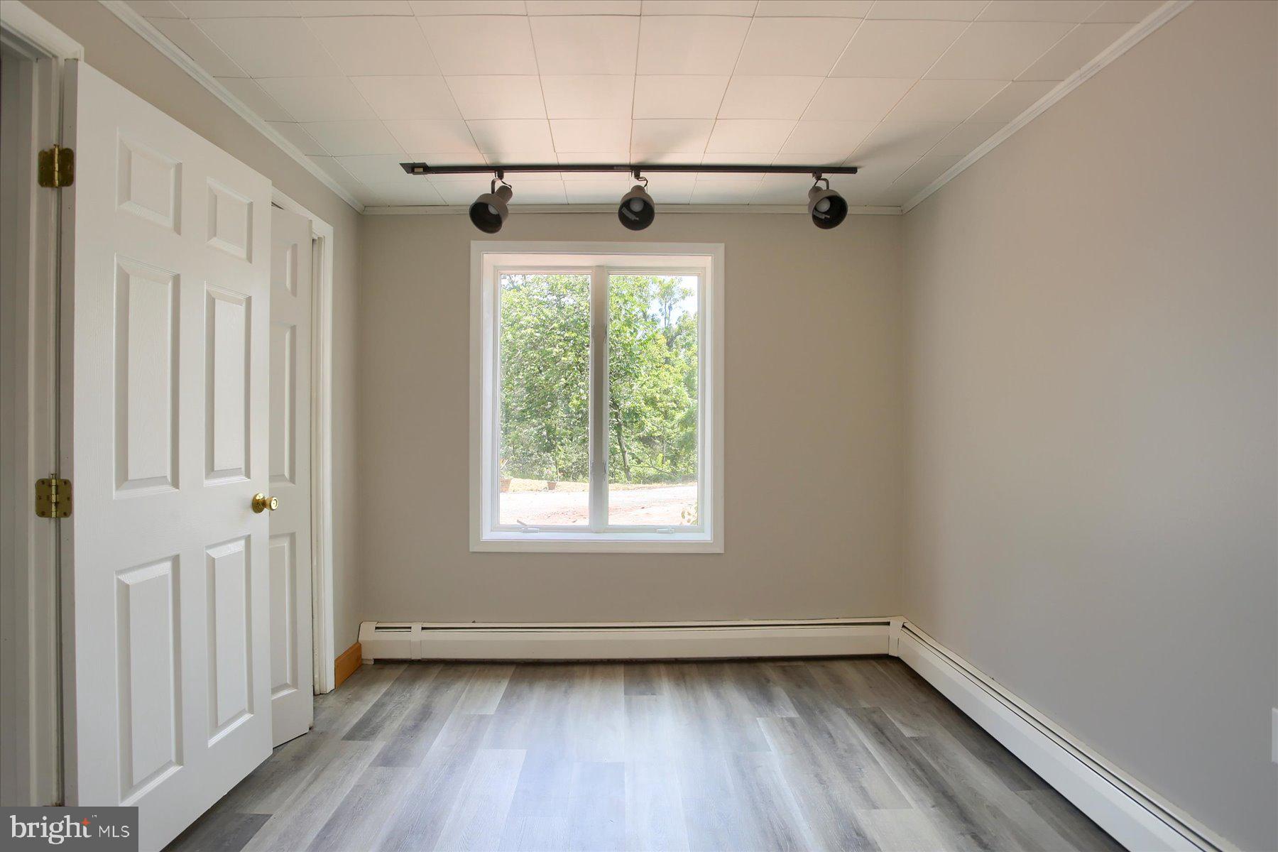 1441 Erney Road Dover, PA 17315 - Photo 30 of 45 a view of empty room with wooden floor and fan