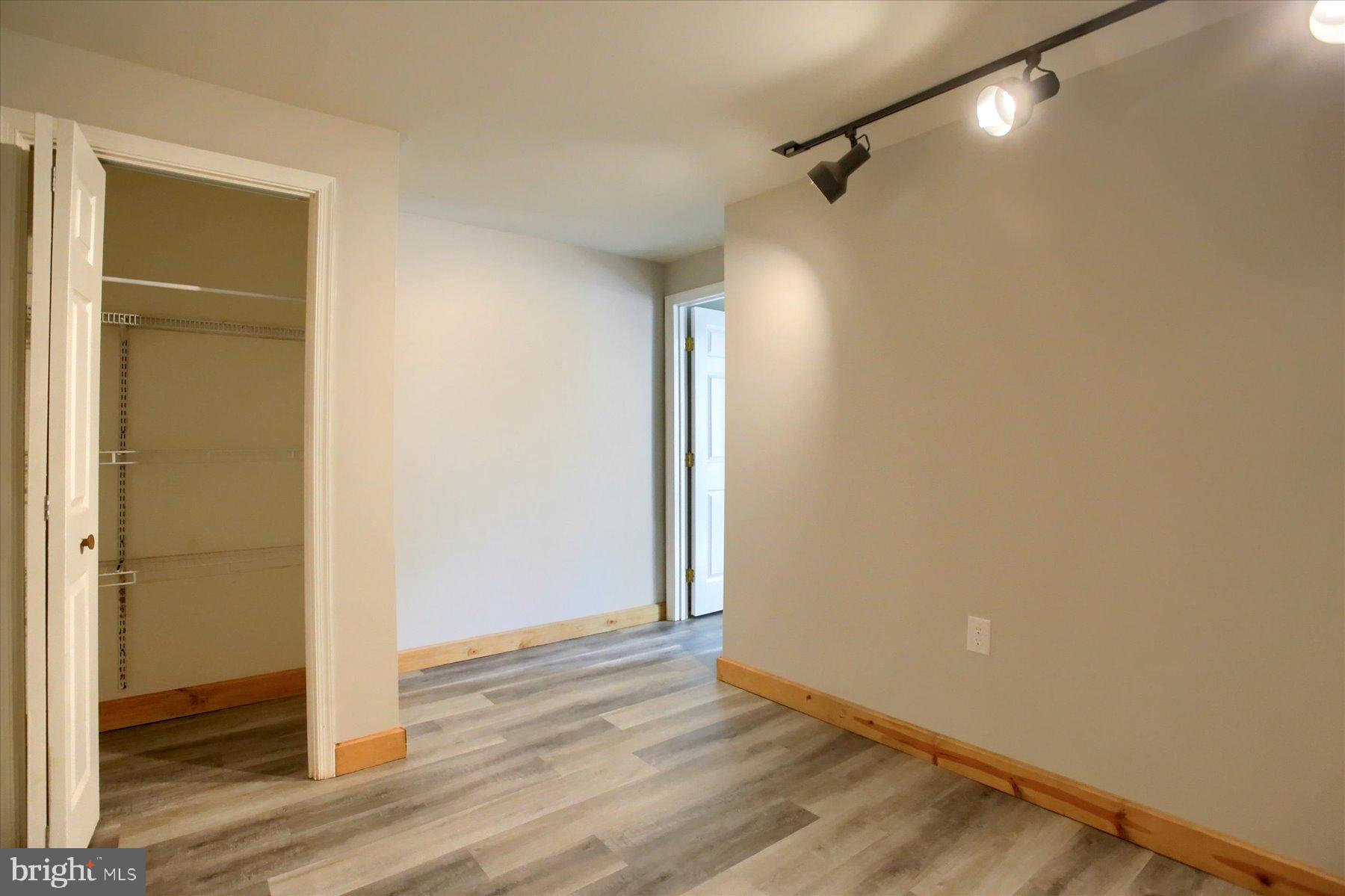 1441 Erney Road Dover, PA 17315 - Photo 33 of 45 a view of a room with wooden floor and a bathroom