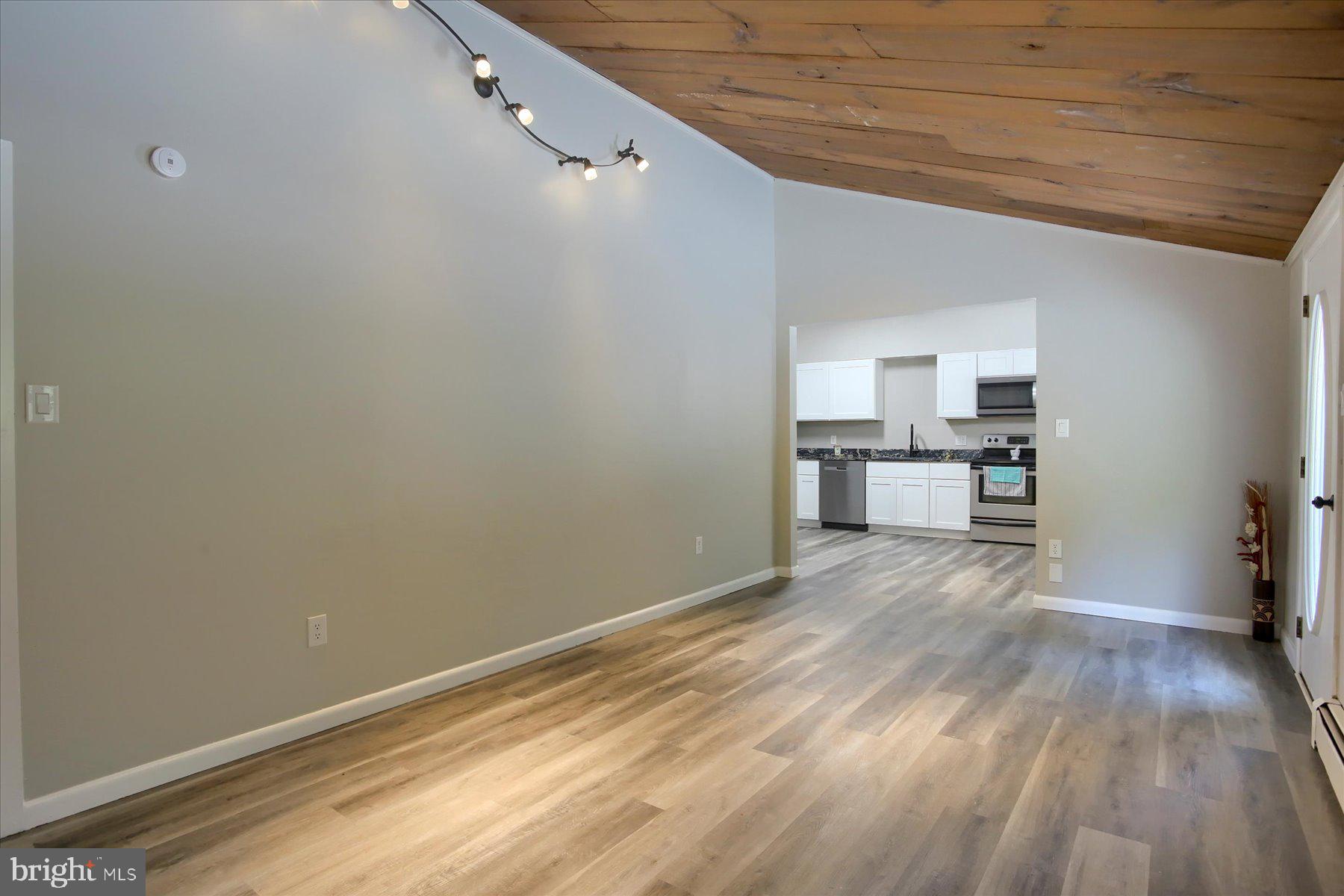 1441 Erney Road Dover, PA 17315 - Photo 7 of 45 a view of a kitchen with wooden floor and a sink