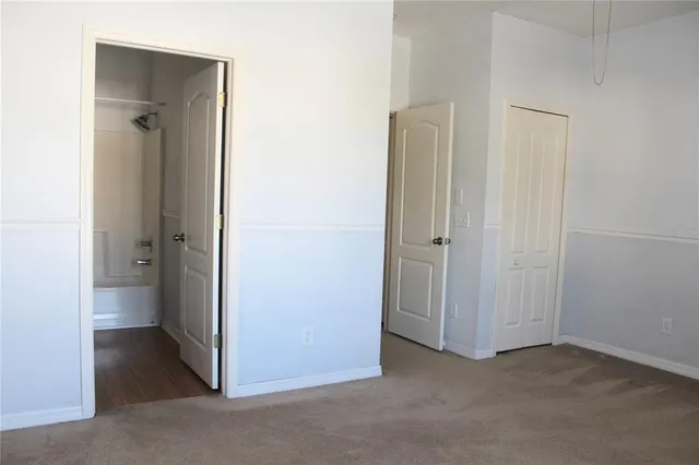 a bathroom with a sink a toilet a mirror and vanity