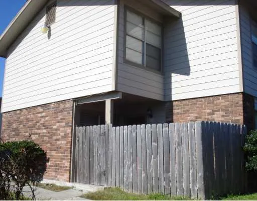 a view of a wooden door of a house