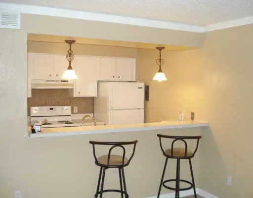 a kitchen with stainless steel appliances a sink and cabinets