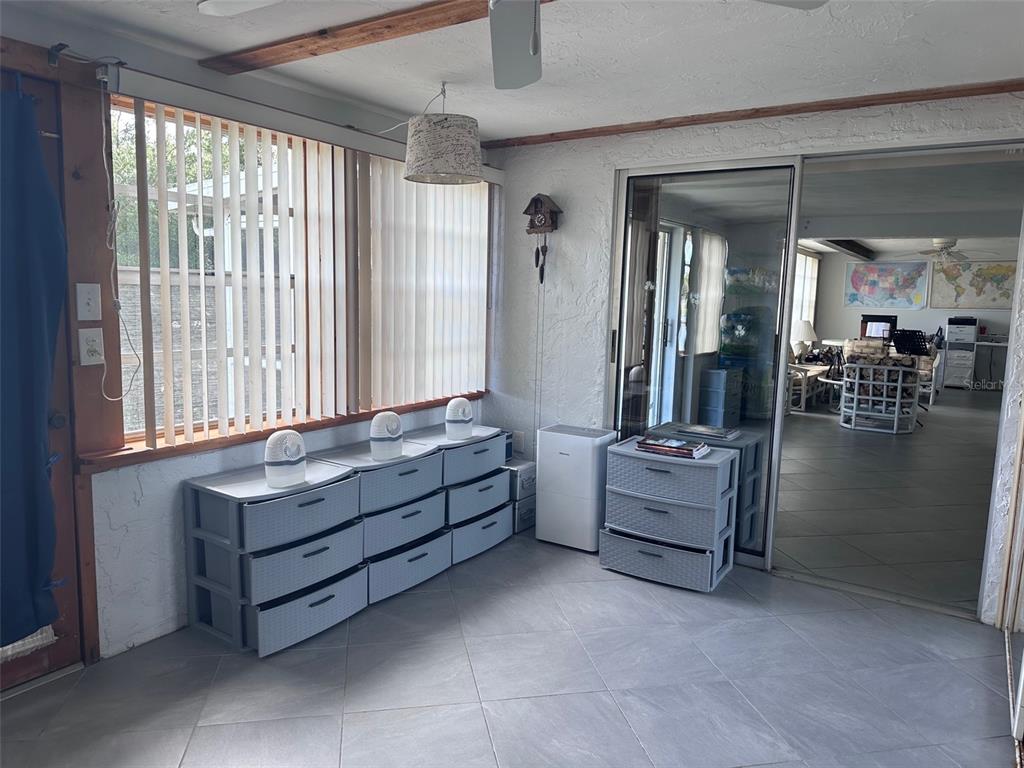 3542 Delta Place Holiday, FL 34691 - Photo 19 of 28 a living room with furniture and a window