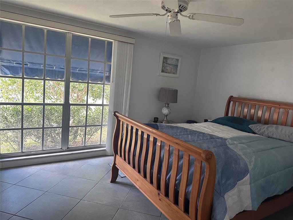 3542 Delta Place Holiday, FL 34691 - Photo 24 of 28 a bedroom with a bed and a window