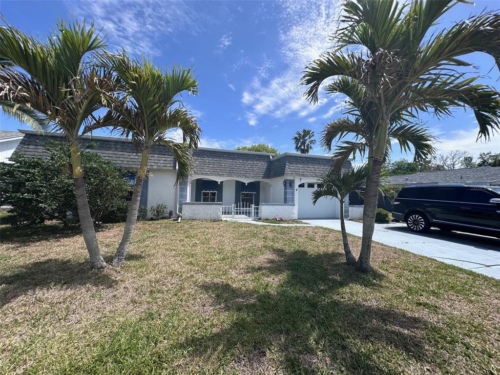 3542 Delta Place Holiday, FL 34691 - Photo 7 of 28 a house view with a backyard space