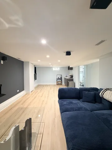 a view of an empty room and wooden floor