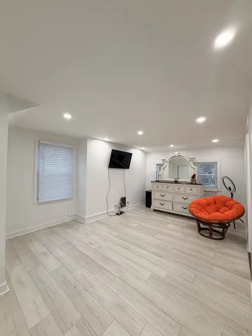 a bathroom with a sink a toilet a mirror and vanity
