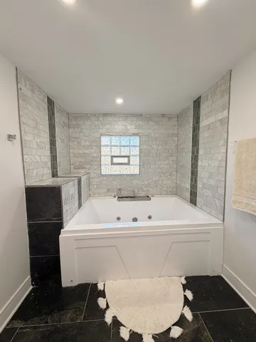 a room with gym equipment and windows