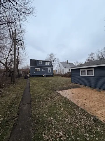 a view of a backyard of the house