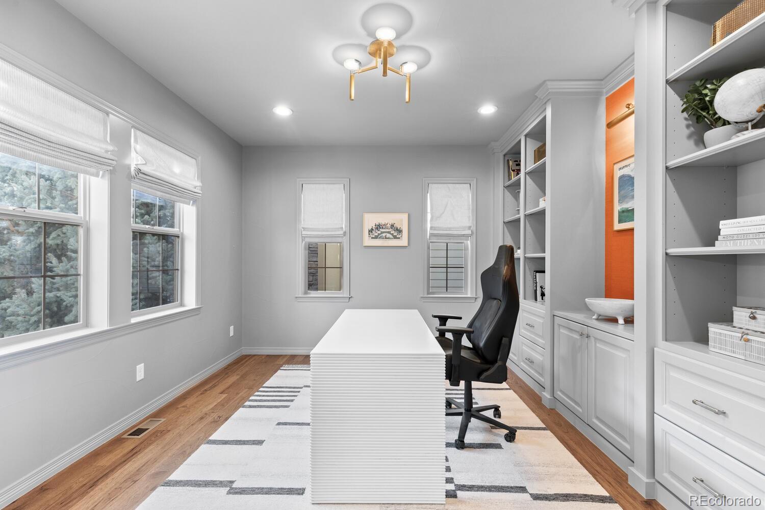10699 Timberdash Avenue Highlands Ranch, CO 80126 - Photo 18 of 50 a view of a workspace with furniture and a window