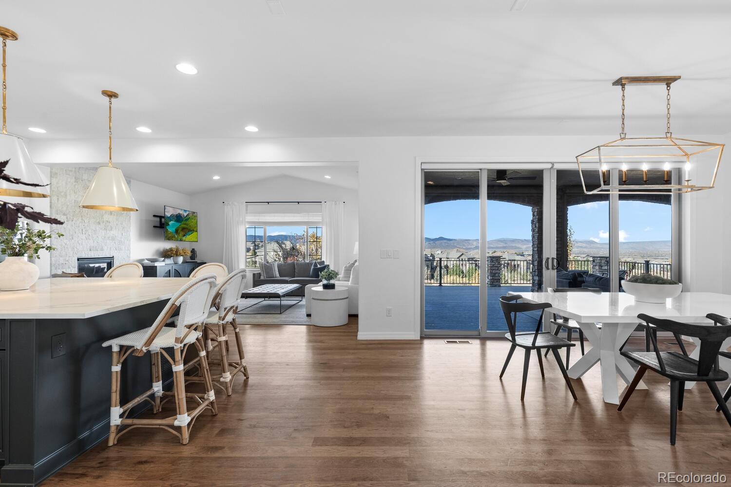 10699 Timberdash Avenue Highlands Ranch, CO 80126 - Photo 2 of 50 a view of a dining room with furniture window and wooden floor