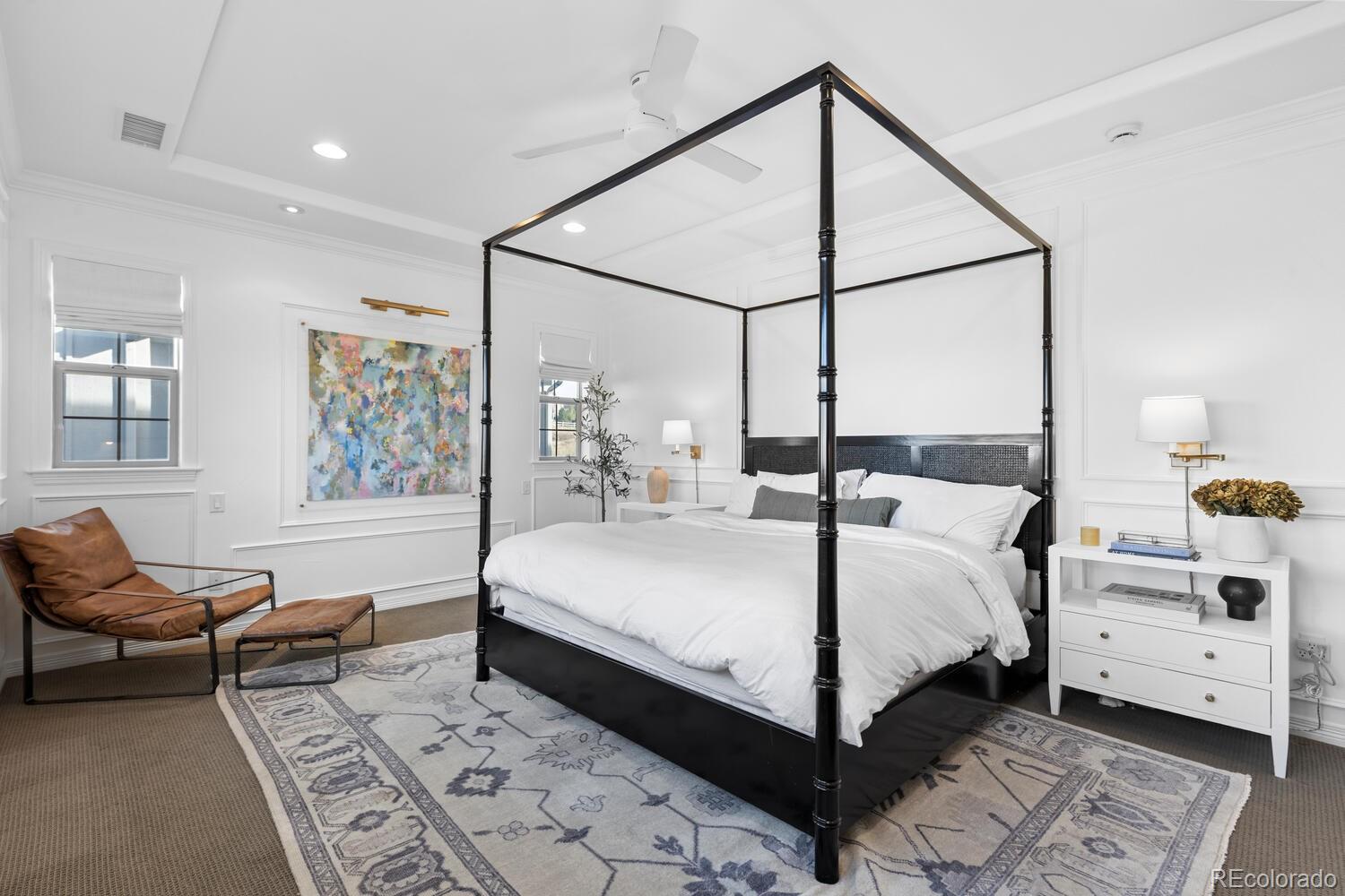 10699 Timberdash Avenue Highlands Ranch, CO 80126 - Photo 27 of 50 a bedroom with a bed and wooden floor