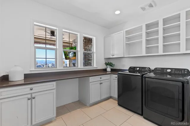 a kitchen with granite countertop a sink stainless steel appliances and cabinets