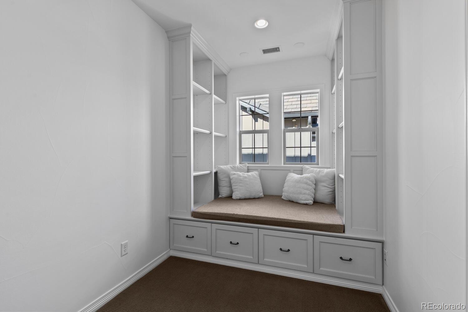 10699 Timberdash Avenue Highlands Ranch, CO 80126 - Photo 33 of 50 a living room with furniture and white walls