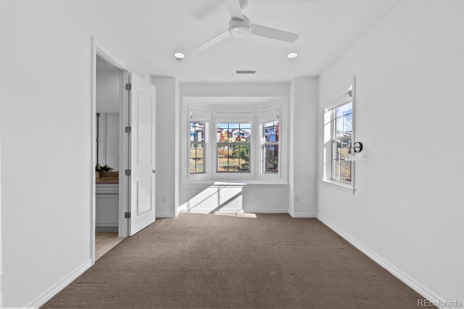 10699 Timberdash Avenue Highlands Ranch, CO 80126 - Photo 36 of 50 a view of an empty room with a window