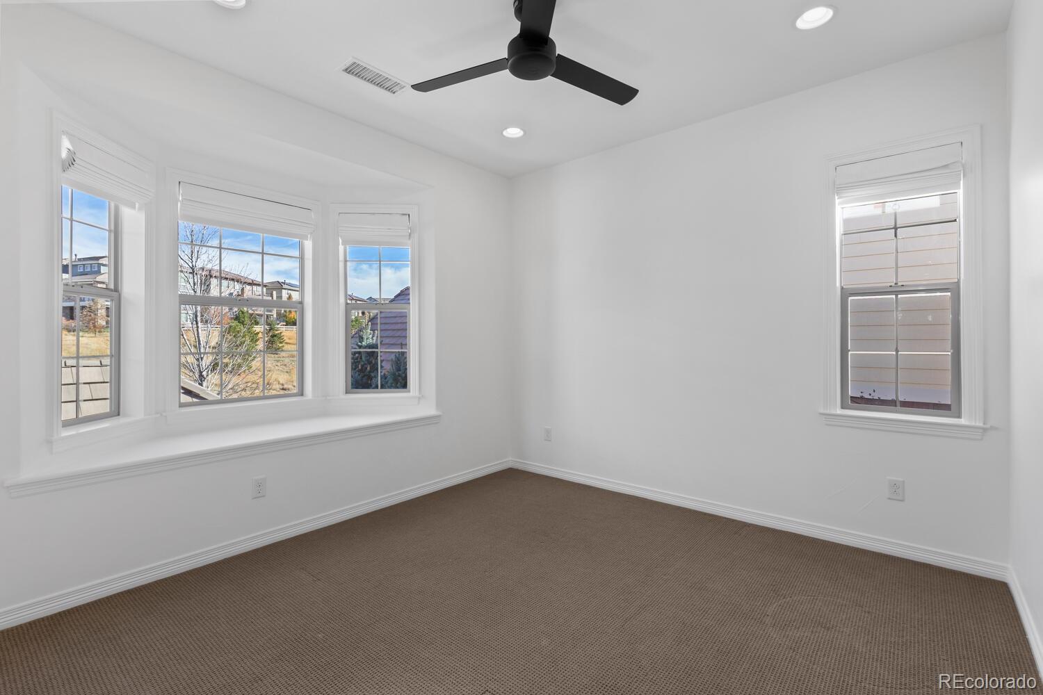 10699 Timberdash Avenue Highlands Ranch, CO 80126 - Photo 39 of 50 a view of an empty room with a window