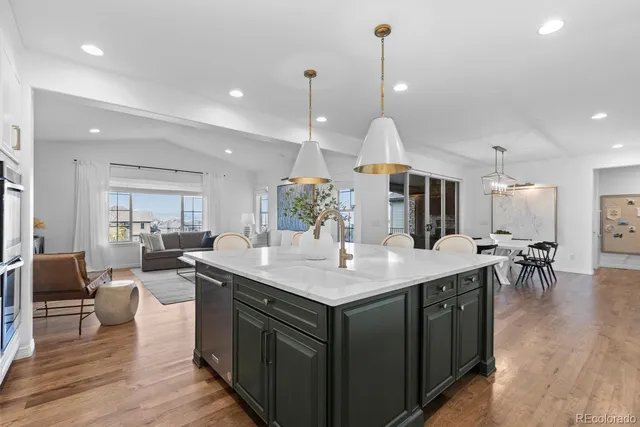a kitchen with a table and chairs in it