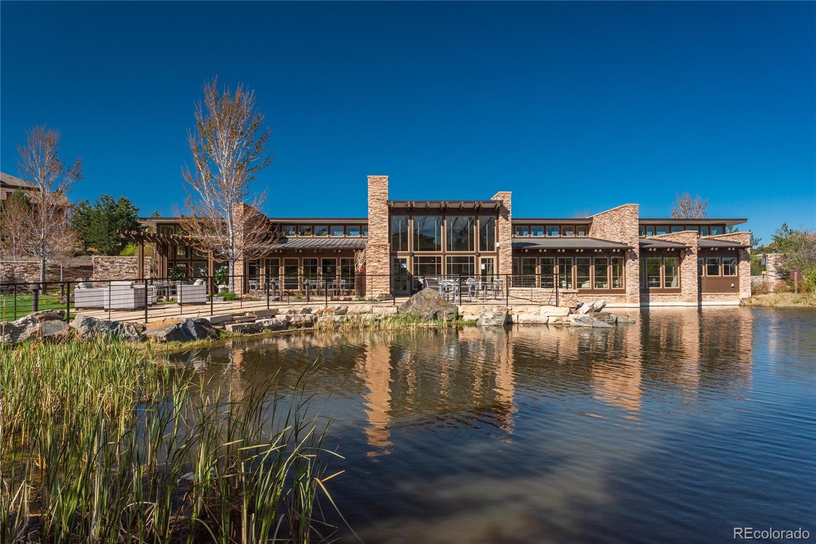 10699 Timberdash Avenue Highlands Ranch, CO 80126 - Photo 48 of 50 a view of pool with table and chairs