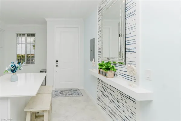 a white bath tub sitting next to a white cabinet