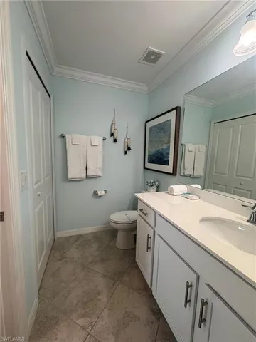 a bathroom with a sink toilet and mirror