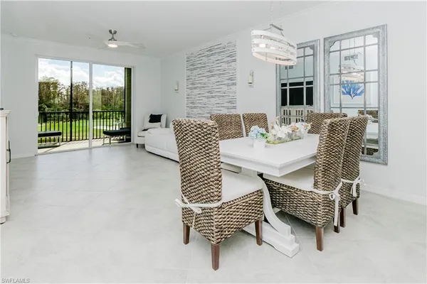 a dining room with furniture and window