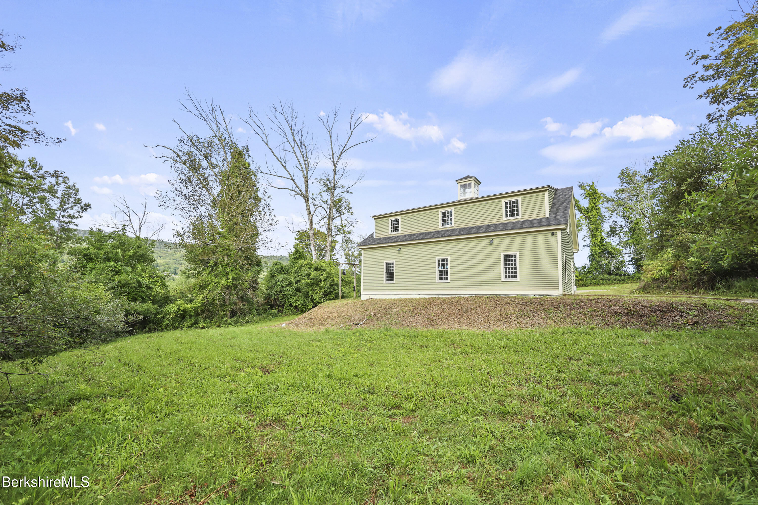 48 Main Road Tyringham, MA 01238 - Photo 19 of 25 a view of a back yard of the house