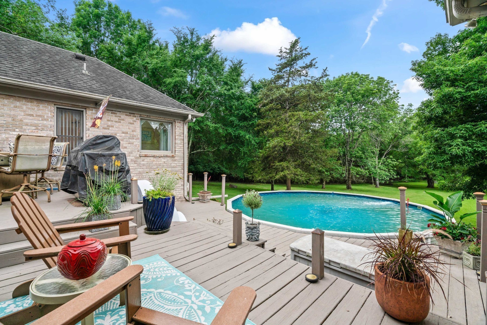 5544 South New Hope Road Hermitage, TN 37076 - Photo 43 of 62 a view of a patio with couches table and chairs and potted plants