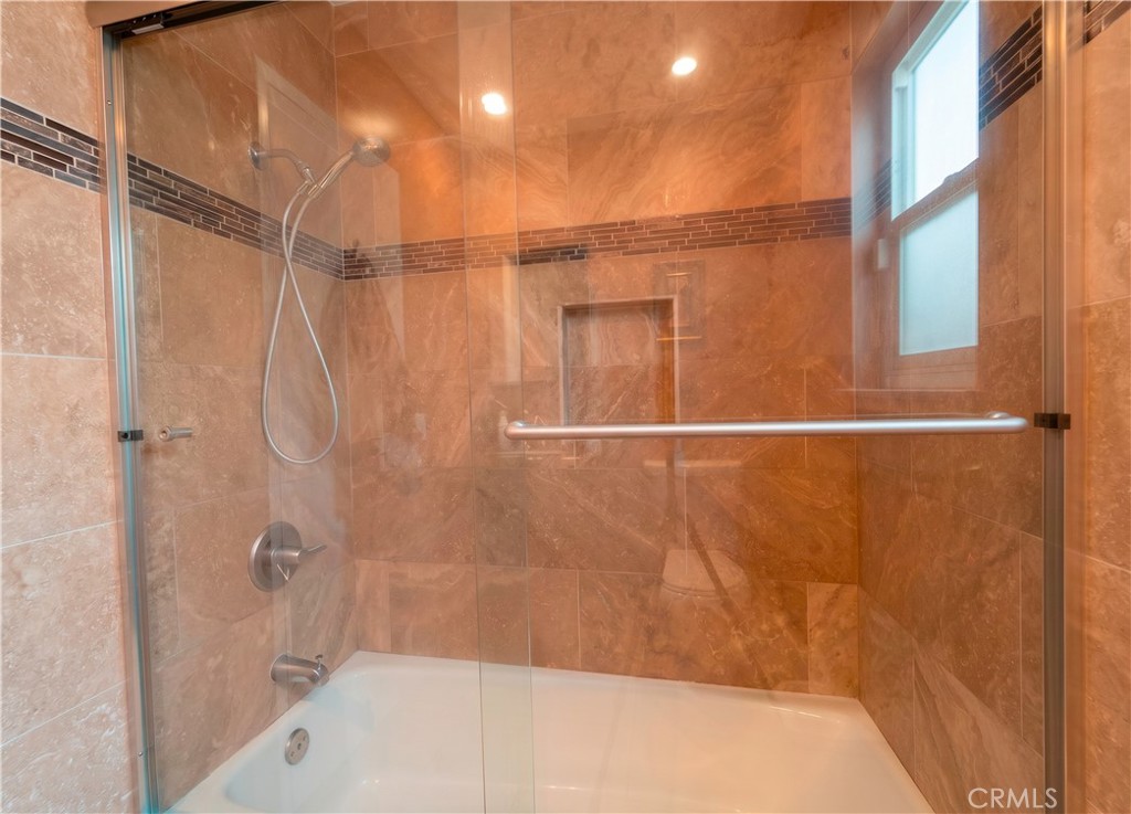 9221 Pico Vista Road Downey, CA 90240 - Photo 14 of 38 a bathroom with a bathtub and a shower