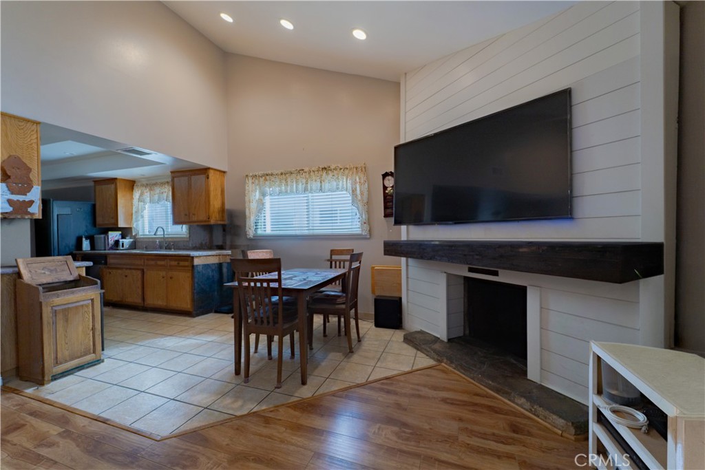 9221 Pico Vista Road Downey, CA 90240 - Photo 17 of 38 a kitchen with a table chairs sink and cabinets
