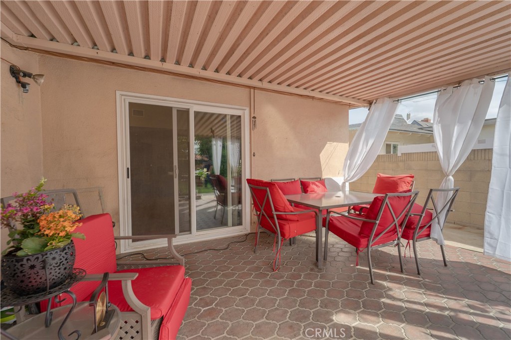 9221 Pico Vista Road Downey, CA 90240 - Photo 25 of 38 a view of a porch with furniture and next to a yard