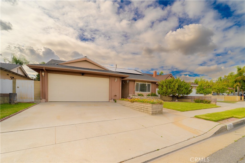 9221 Pico Vista Road Downey, CA 90240 - Photo 28 of 38 a view of a house with a big yard and large trees