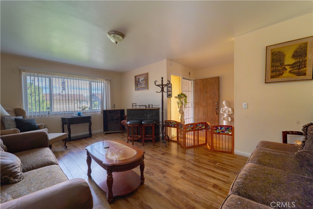 9221 Pico Vista Road Downey, CA 90240 - Photo 4 of 38 a living room with furniture and wooden floor
