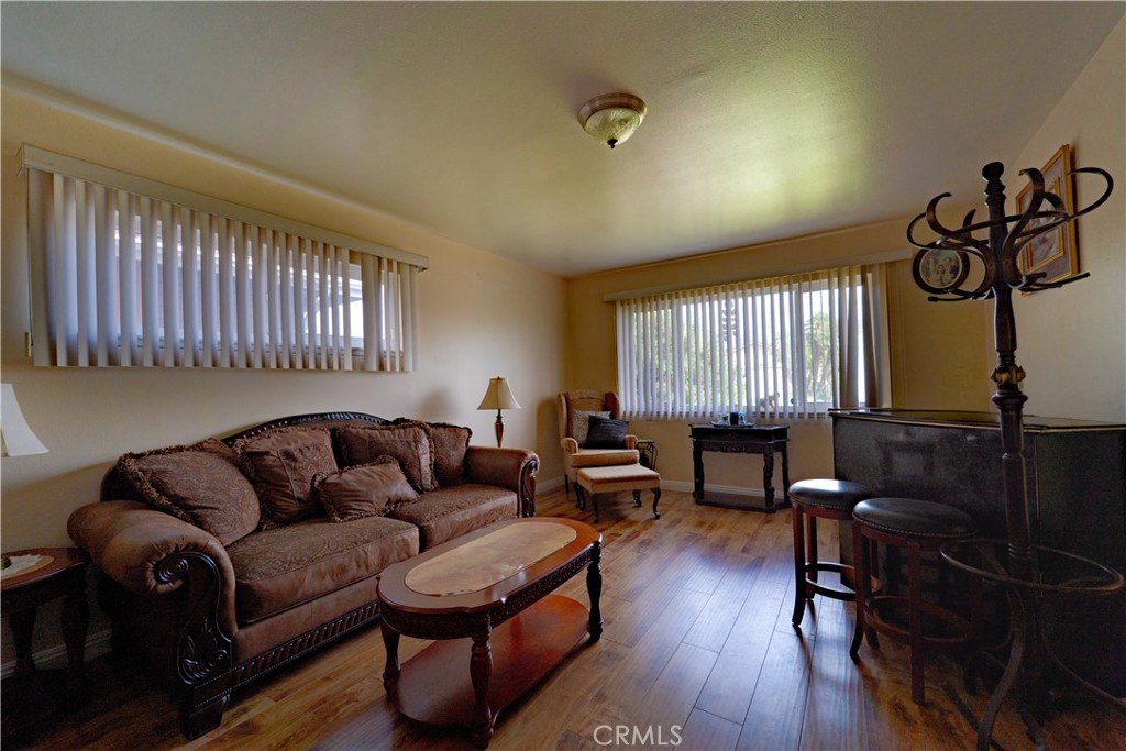 9221 Pico Vista Road Downey, CA 90240 - Photo 5 of 38 a living room with furniture and a wooden floor