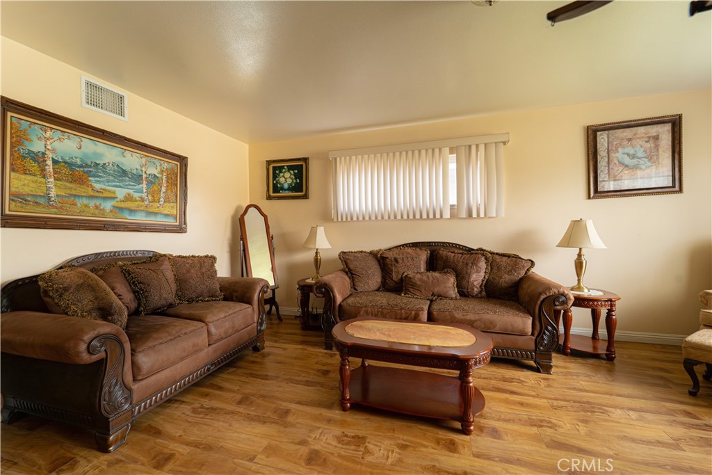 9221 Pico Vista Road Downey, CA 90240 - Photo 6 of 38 a living room with furniture and a large window