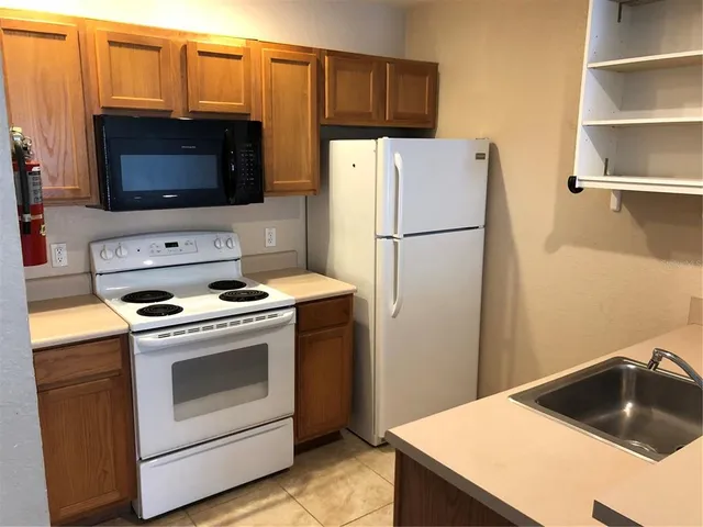 a view of a lake view with houses in background