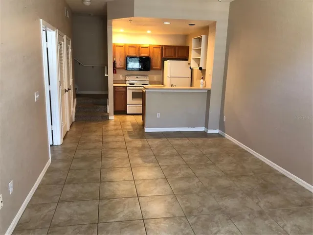 a room with a washing machine and a sink