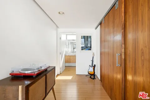 a view of a livingroom with furniture and hardwood floor