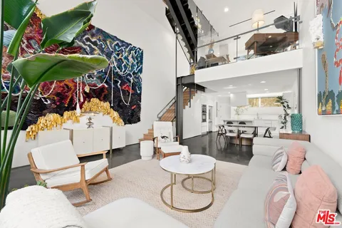 a outdoor living space with furniture and a rug