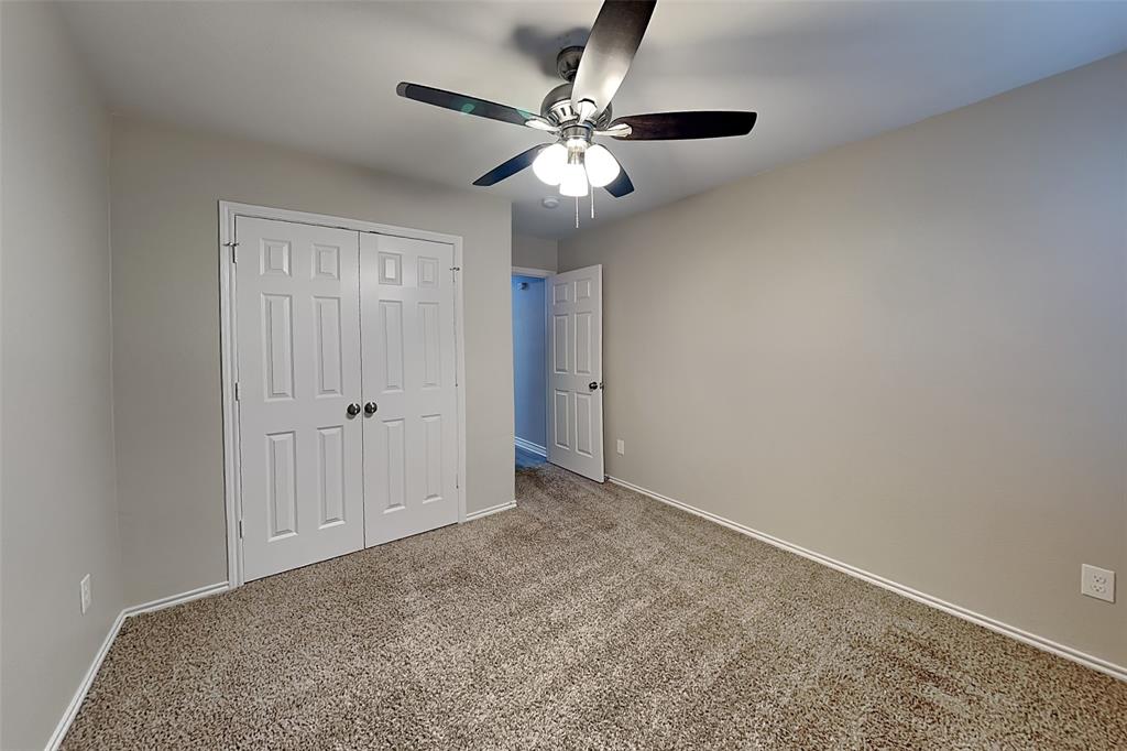 105 Independence Trail Forney, TX 75126 - Photo 14 of 18 an empty room with closet and fan