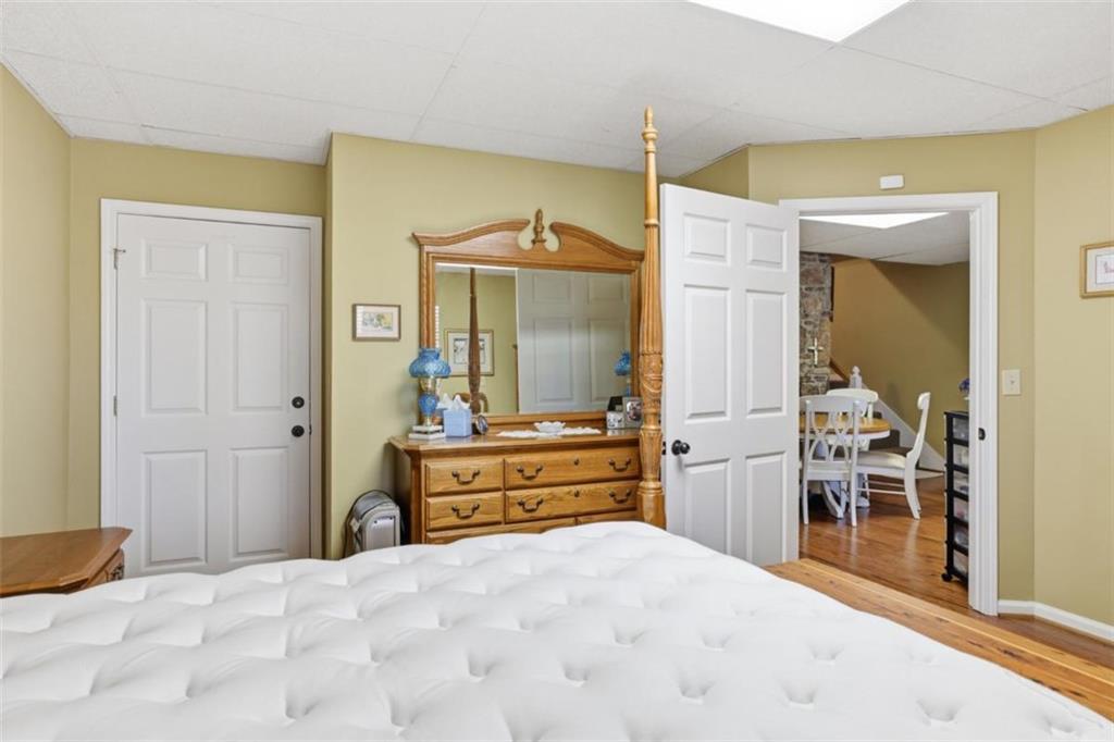 1401 Adair Mill Road Cleveland, GA 30528 - Photo 38 of 62 a large bedroom with a bed and a dresser