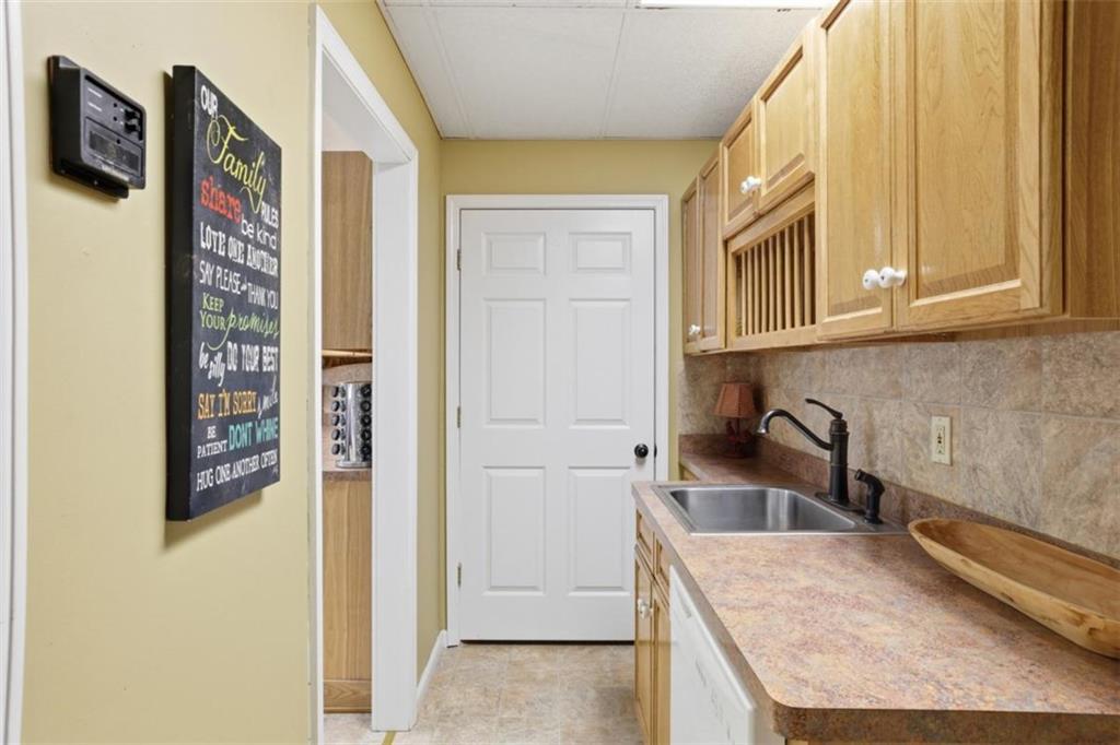 1401 Adair Mill Road Cleveland, GA 30528 - Photo 41 of 62 a kitchen with a refrigerator and cabinets