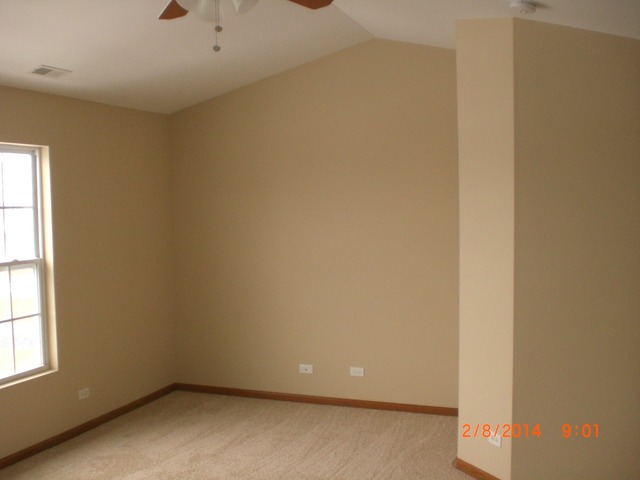 1974 West Cobblestone Road, Unit 3532303 Romeoville, IL 60446 - Photo 17 of 23 an empty room with a window
