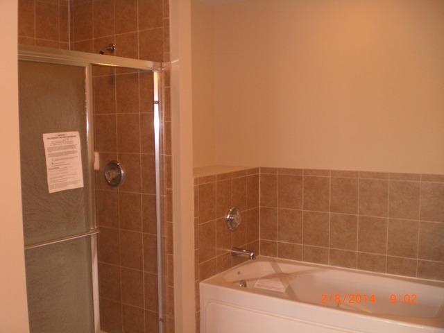1974 West Cobblestone Road, Unit 3532303 Romeoville, IL 60446 - Photo 19 of 23 a bathroom with a bathtub