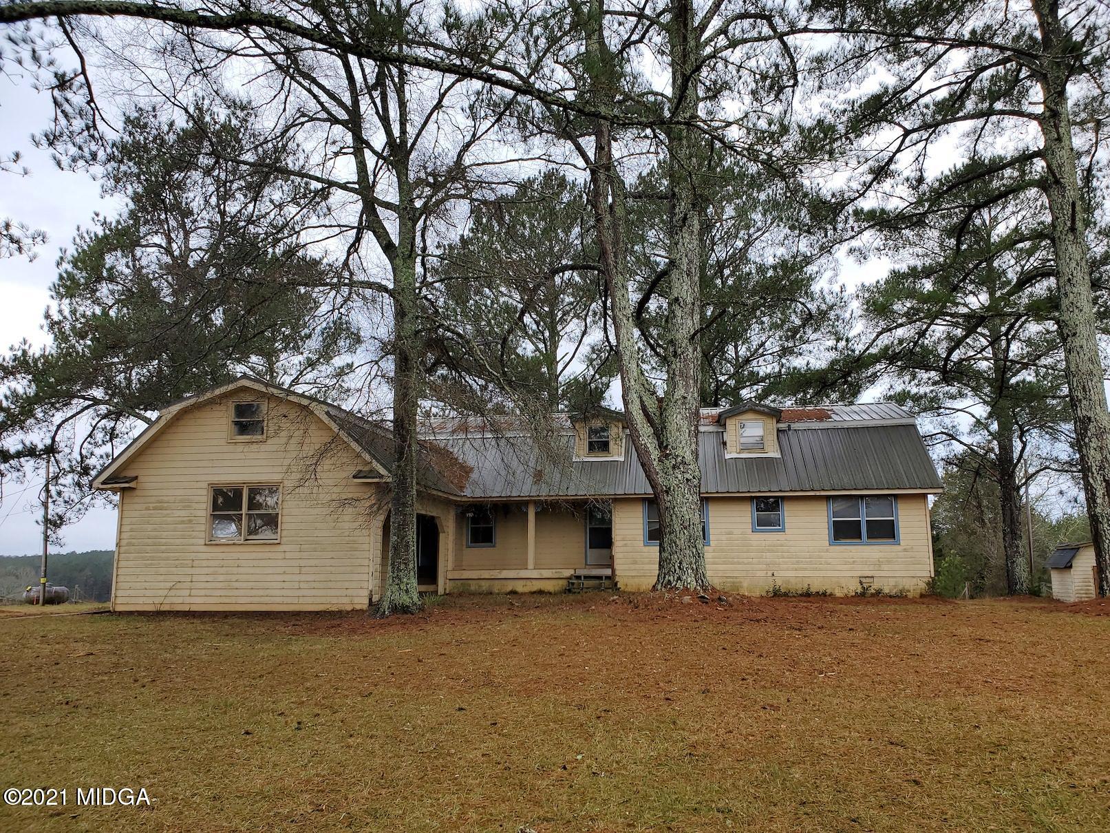 462 Thomas Ferry Road Jackson, GA 30233 - Photo 1 of 27 a front view of a house with a trees
