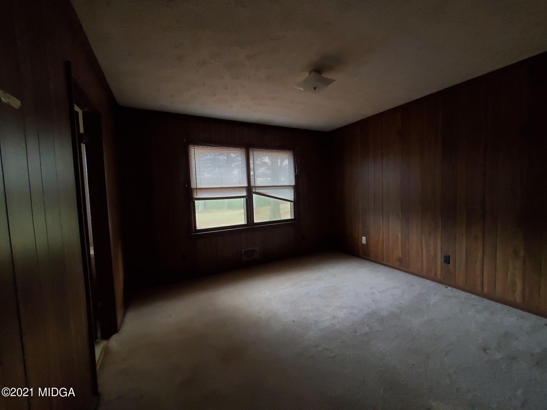 462 Thomas Ferry Road Jackson, GA 30233 - Photo 11 of 27 a view of an empty room with a window