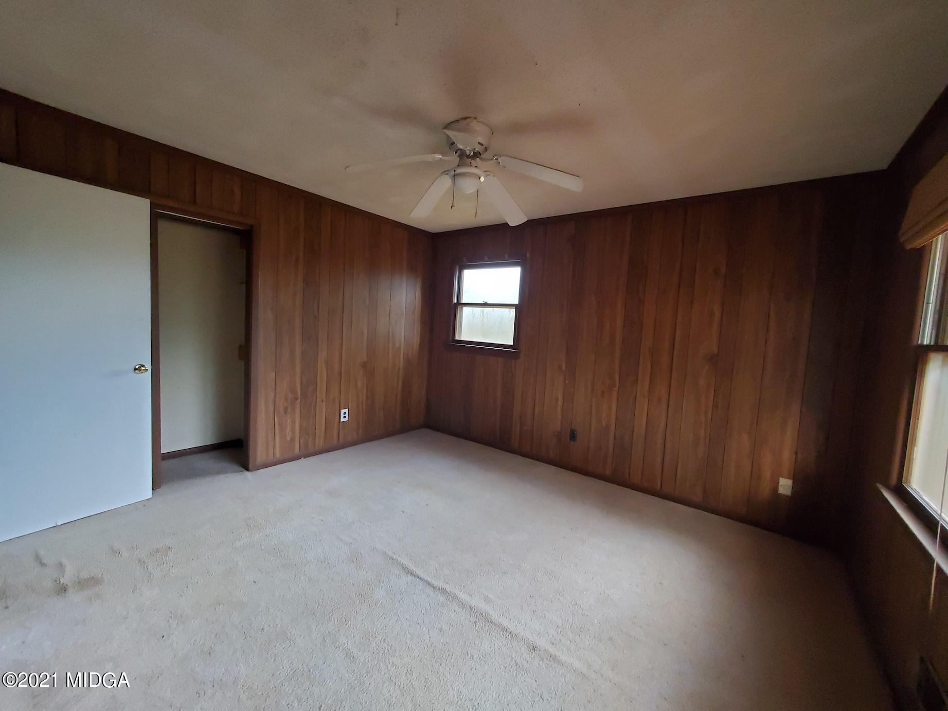 462 Thomas Ferry Road Jackson, GA 30233 - Photo 13 of 27 an empty room with a window and a ceiling fan