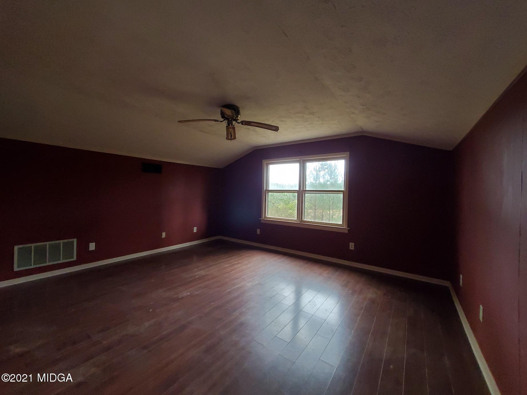 462 Thomas Ferry Road Jackson, GA 30233 - Photo 18 of 27 a view of an empty room with a window