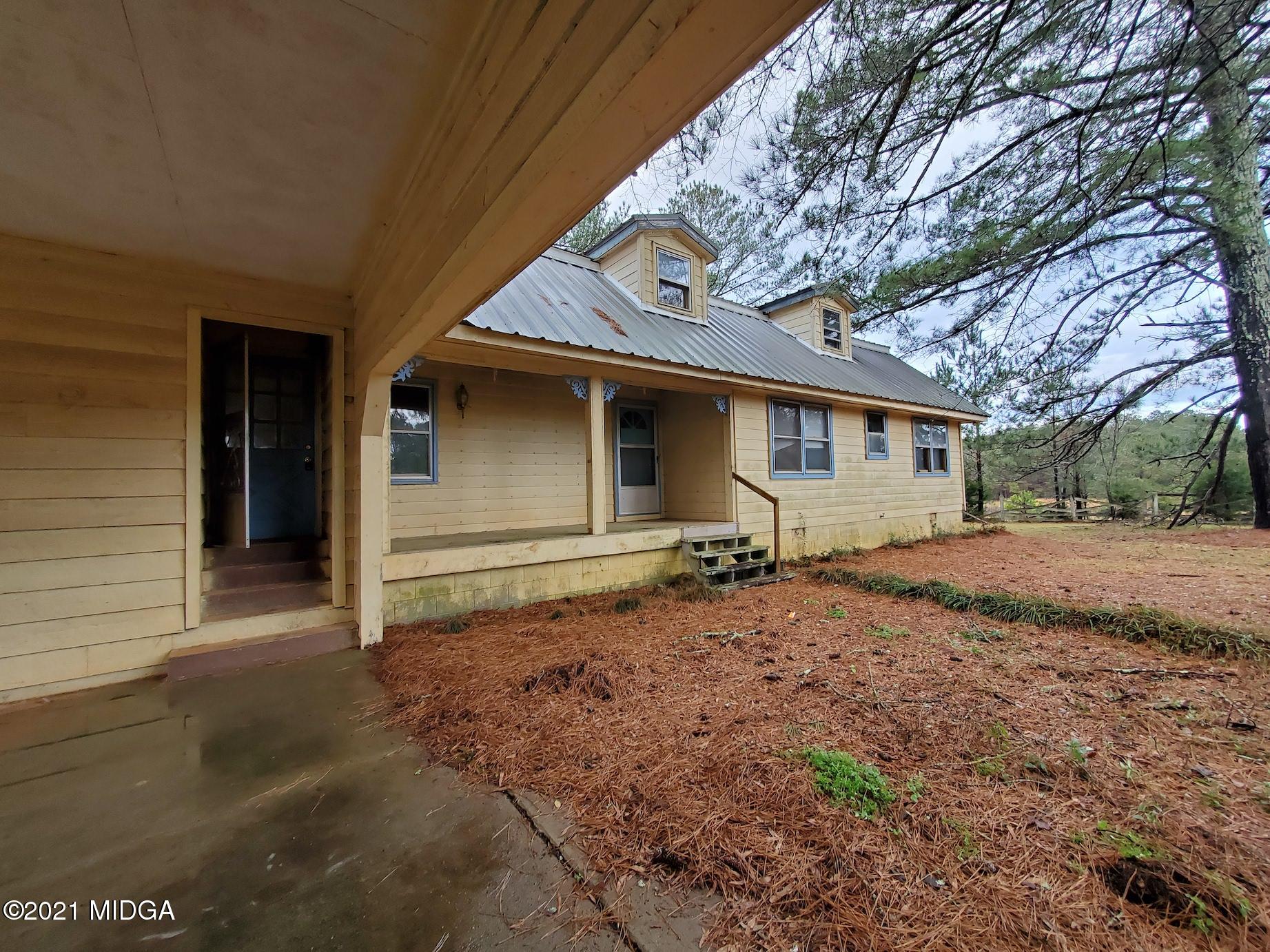 462 Thomas Ferry Road Jackson, GA 30233 - Photo 19 of 27 a front view of a house with a yard