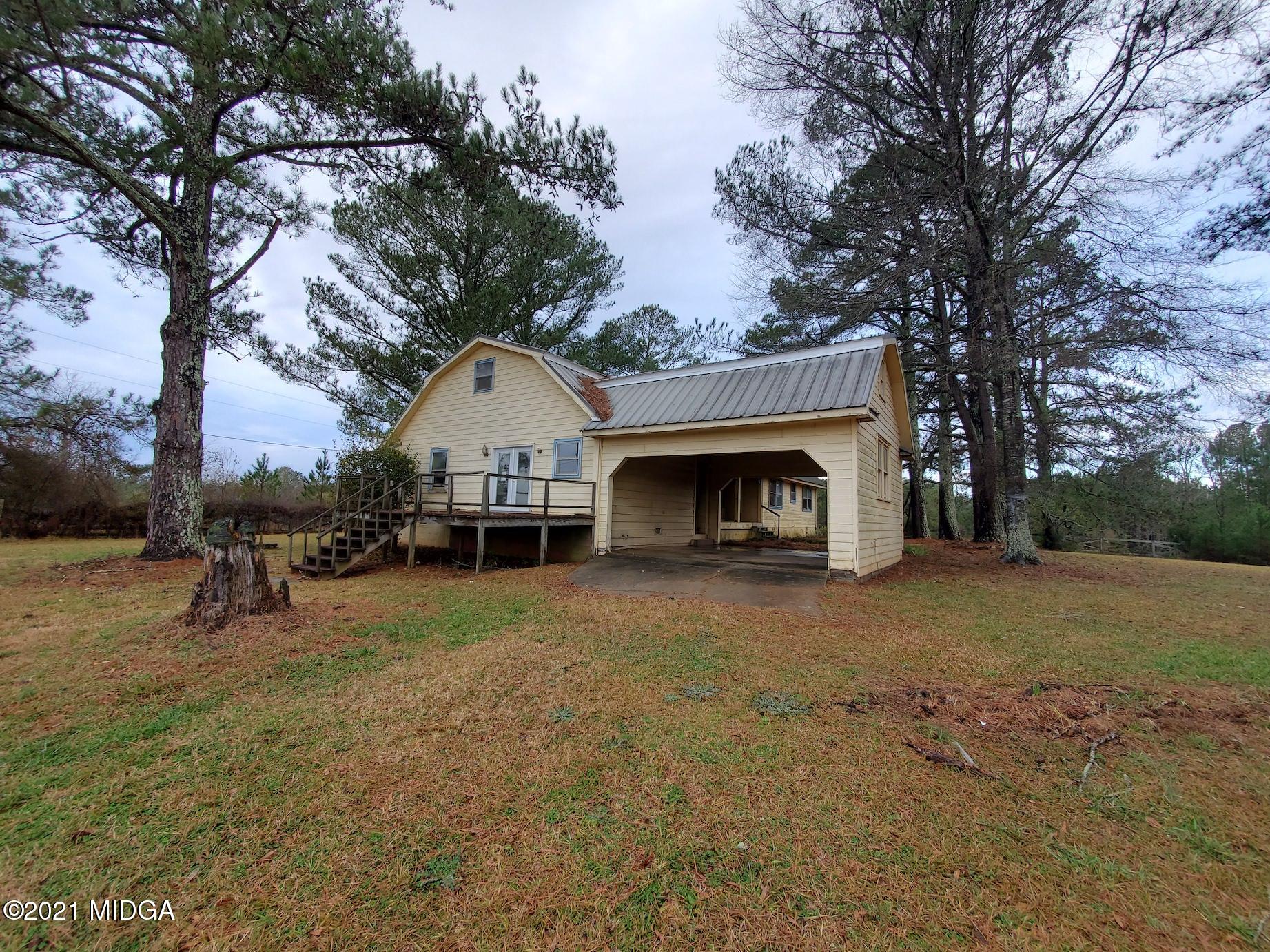 462 Thomas Ferry Road Jackson, GA 30233 - Photo 20 of 27 a view of a house with a yard