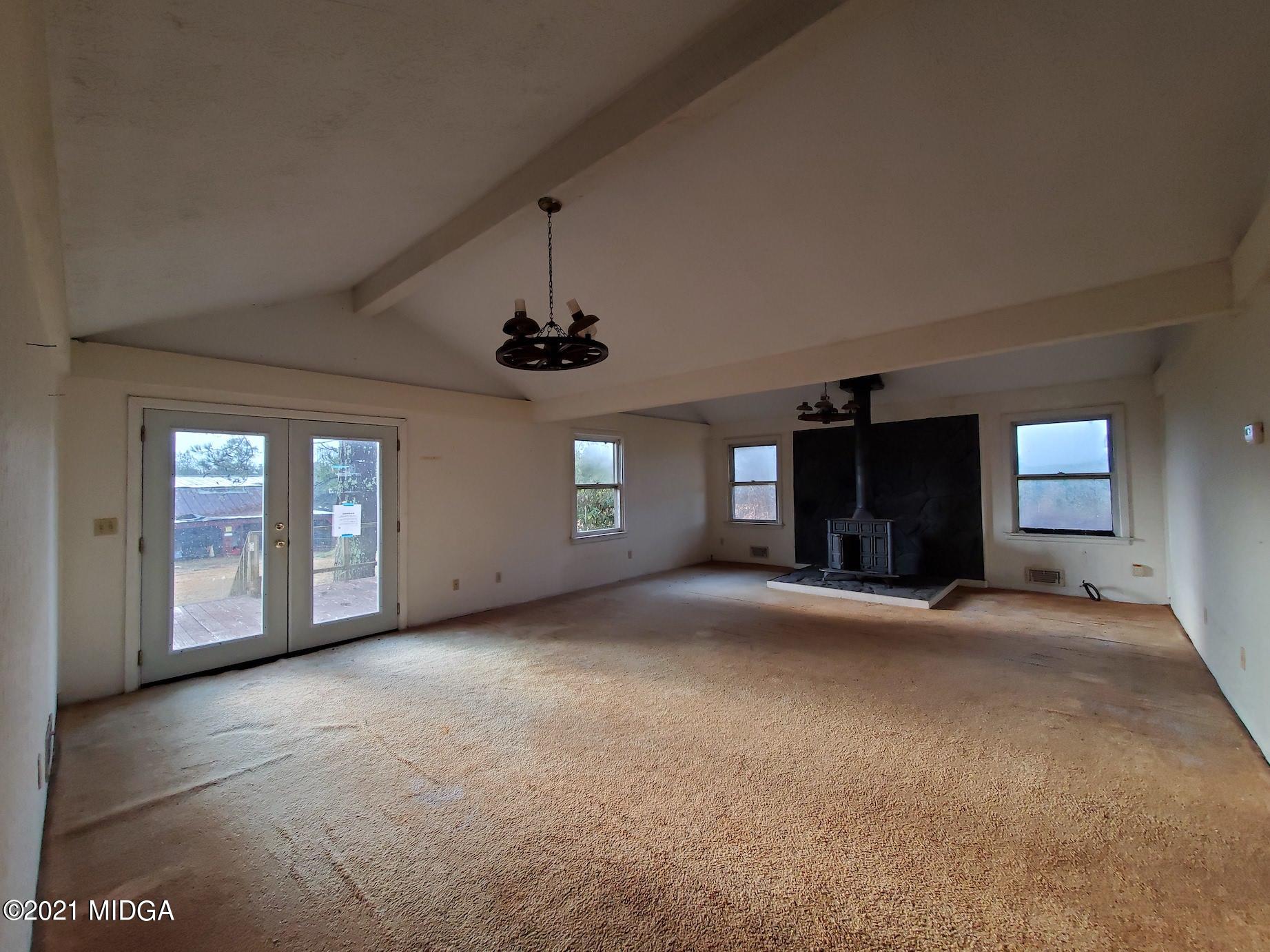 462 Thomas Ferry Road Jackson, GA 30233 - Photo 3 of 27 a view of a room with chandelier and windows